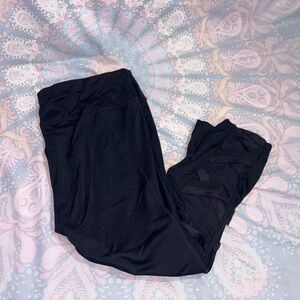 Black athletic Leggings  with mesh on the side of shins